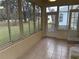 Bright sunroom with tiled floor and view of backyard at 10913 Sw 69Th Cir, Ocala, FL 34476