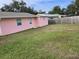 Small backyard with patchy grass and wooden fence at 12451 Se 135Th Ct, Ocklawaha, FL 32179