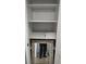 Empty closet with shelves; mirror and box on floor at 1570 Se 27Th St # H, Ocala, FL 34471