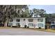 Two-story building with green accents and landscaping at 1570 Se 27Th St # H, Ocala, FL 34471