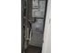 Older HVAC unit in closet with exposed wiring and pipes at 1570 Se 27Th St # H, Ocala, FL 34471
