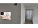 Hallway view with wood-look floors and access to rooms at 1570 Se 27Th St # H, Ocala, FL 34471