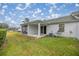 Screened patio with grassy backyard and AC unit at 2505 Se 18Th Cir, Ocala, FL 34471