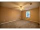 Bright bedroom with window, ceiling fan and carpet flooring at 2505 Se 18Th Cir, Ocala, FL 34471