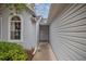 Side entry to the house with a walkway at 2505 Se 18Th Cir, Ocala, FL 34471