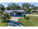 Attractive ranch home with circular driveway and large backyard at 5002 Se 7Th Pl, Ocala, FL 34471