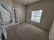 Home office with carpet flooring and large window at 5097 Sw 40Th Pl, Ocala, FL 34474