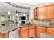 Kitchen boasts granite countertops and ample wood cabinetry at 5098 Nw 35Th Lane Rd, Ocala, FL 34482