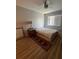 Cozy bedroom with a double bed, nightstand, and ceiling fan at 548 Fairways Dr # B, Ocala, FL 34472