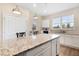 Large kitchen island with granite countertop, perfect for casual dining at 6216 Sw 94Th Ter, Ocala, FL 34481