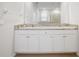 Bathroom with double vanity and granite countertop at 6243 Sw 89Th Street Rd, Ocala, FL 34476