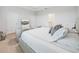 Main bedroom with a king-size bed and two armchairs at 6243 Sw 89Th Street Rd, Ocala, FL 34476