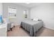 Guest bedroom with queen bed and sitting chair at 6243 Sw 89Th Street Rd, Ocala, FL 34476