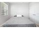 Simple bedroom with a gray comforter and ample closet space at 6243 Sw 89Th Street Rd, Ocala, FL 34476