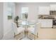 Bright dining area with glass table and white chairs at 6243 Sw 89Th Street Rd, Ocala, FL 34476