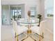Breakfast nook with glass table and white chairs at 6243 Sw 89Th Street Rd, Ocala, FL 34476