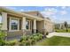One-story home with tan siding, stone accents, and landscaping at 6243 Sw 89Th Street Rd, Ocala, FL 34476