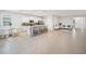 Open concept kitchen with white cabinets and large island at 6243 Sw 89Th Street Rd, Ocala, FL 34476