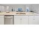 Kitchen island with granite countertop and sink at 6243 Sw 89Th Street Rd, Ocala, FL 34476