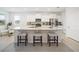 Modern kitchen with granite island and stainless steel appliances at 6243 Sw 89Th Street Rd, Ocala, FL 34476