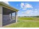 Screened porch offers relaxing outdoor space and a view at 6243 Sw 89Th Street Rd, Ocala, FL 34476