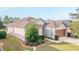Aerial view of charming house with well-manicured lawn at 6622 Sw 97Th Terrace Rd, Ocala, FL 34481