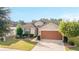 Aerial view of house, showcasing front yard and driveway at 6622 Sw 97Th Terrace Rd, Ocala, FL 34481