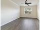 Bright bedroom with ceiling fan and large window at 6622 Sw 97Th Terrace Rd, Ocala, FL 34481