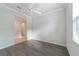 Bright bedroom with wood-look floors and ceiling fan at 6622 Sw 97Th Terrace Rd, Ocala, FL 34481