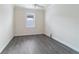 Spacious bedroom featuring wood-look floors and ceiling fan at 6622 Sw 97Th Terrace Rd, Ocala, FL 34481