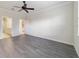 Primary bedroom with ceiling fan and access to bathroom at 6622 Sw 97Th Terrace Rd, Ocala, FL 34481