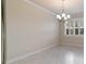 Bright dining room with chandelier and large windows at 6622 Sw 97Th Terrace Rd, Ocala, FL 34481