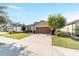 House exterior with a driveway, sidewalk, and landscaping at 6622 Sw 97Th Terrace Rd, Ocala, FL 34481