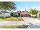 House exterior showcasing a driveway and front yard at 6622 Sw 97Th Terrace Rd, Ocala, FL 34481