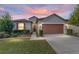 One-story home with attached garage, landscaping, and walkway at 6622 Sw 97Th Terrace Rd, Ocala, FL 34481