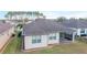 Single-story house with screened patio, landscaped yard, and shingle roof at 6622 Sw 97Th Terrace Rd, Ocala, FL 34481