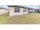 House exterior showcasing backyard and landscaping at 6622 Sw 97Th Terrace Rd, Ocala, FL 34481