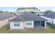 Single-story house with screened patio, landscaped yard, and shingle roof at 6622 Sw 97Th Terrace Rd, Ocala, FL 34481