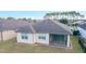 Single-story house with screened patio, landscaped yard, and shingle roof at 6622 Sw 97Th Terrace Rd, Ocala, FL 34481
