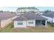 Single-story house with screened patio, landscaped yard, and shingle roof at 6622 Sw 97Th Terrace Rd, Ocala, FL 34481