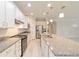 Modern kitchen with white cabinets and granite countertops at 6622 Sw 97Th Terrace Rd, Ocala, FL 34481