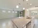 Modern kitchen island with granite countertops and stainless steel appliances at 6622 Sw 97Th Terrace Rd, Ocala, FL 34481
