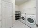 Laundry room with washer, dryer, shelving, and built-in storage at 6622 Sw 97Th Terrace Rd, Ocala, FL 34481