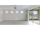 Spacious living room with tile floors and sliding glass doors at 6622 Sw 97Th Terrace Rd, Ocala, FL 34481