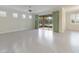 Spacious living room with tile floors and sliding doors to backyard at 6622 Sw 97Th Terrace Rd, Ocala, FL 34481