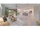 Open living room features tile floors and access to the backyard at 6622 Sw 97Th Terrace Rd, Ocala, FL 34481