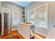 Modern kitchen featuring white cabinetry and stainless steel appliances at 728 E Fort King St, Ocala, FL 34471