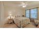 Bedroom with floral bedding and ample natural light at 8225 Sw 108Th Loop, Ocala, FL 34481