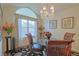Bright dining room with glass-top table and hardwood floors at 8225 Sw 108Th Loop, Ocala, FL 34481