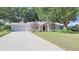 Cute ranch home with attached two-car garage and well-manicured lawn at 8225 Sw 108Th Loop, Ocala, FL 34481